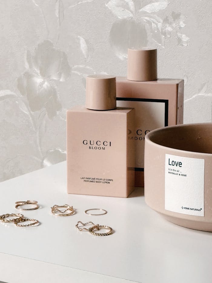 Sophisticated arrangement of Gucci Bloom perfume with elegant accessories. Perfect for luxury and lifestyle representation.