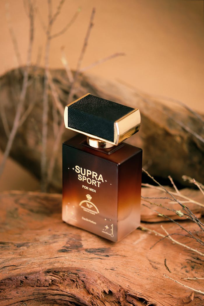 Luxury men's perfume bottle displayed on rustic wood with earthy tones.