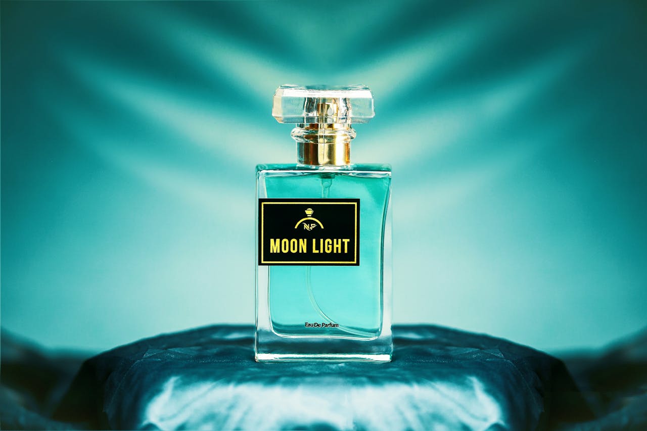 Elegant Moon Light perfume bottle in soft blue lighting, highlighting its luxury and premium appeal.